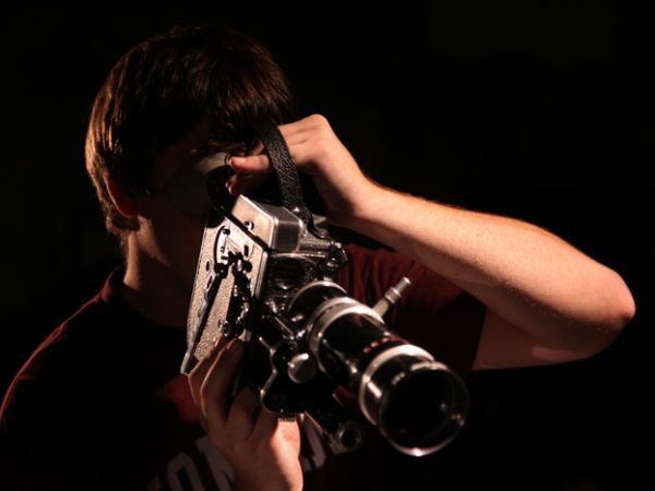a university of montana school of visual arts and media student shooting with a film camera